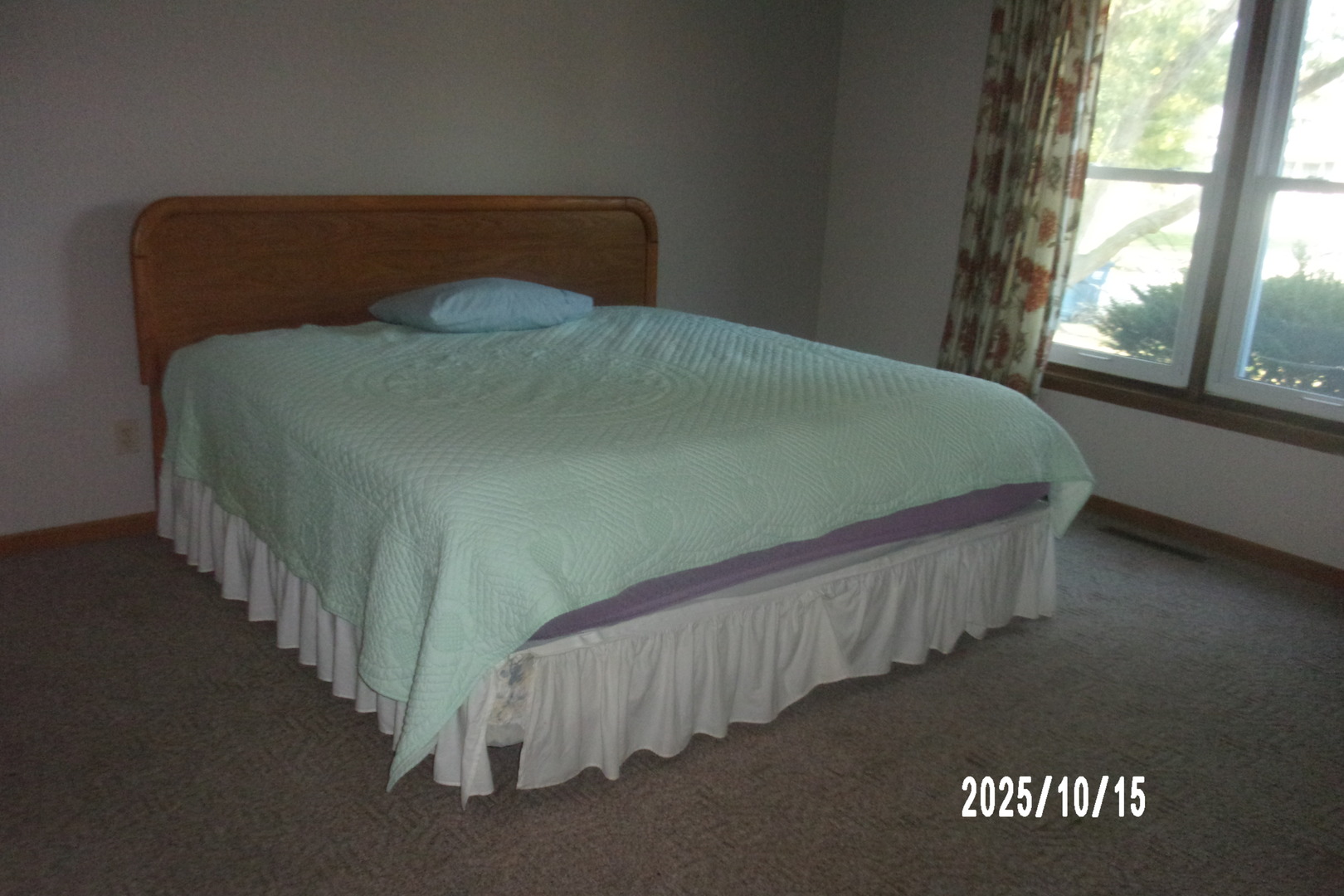 707 East Ash Street Watseka, IL 60970 - Photo 19 of 25 a bed sitting in a bedroom next to a window