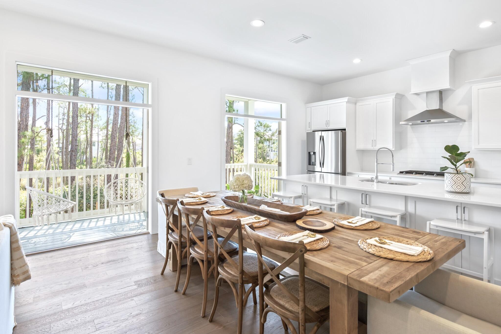 391 Matt's Way Santa Rosa Beach, FL 32459 - Photo 20 of 61 a view of a dining room with furniture window and outside view