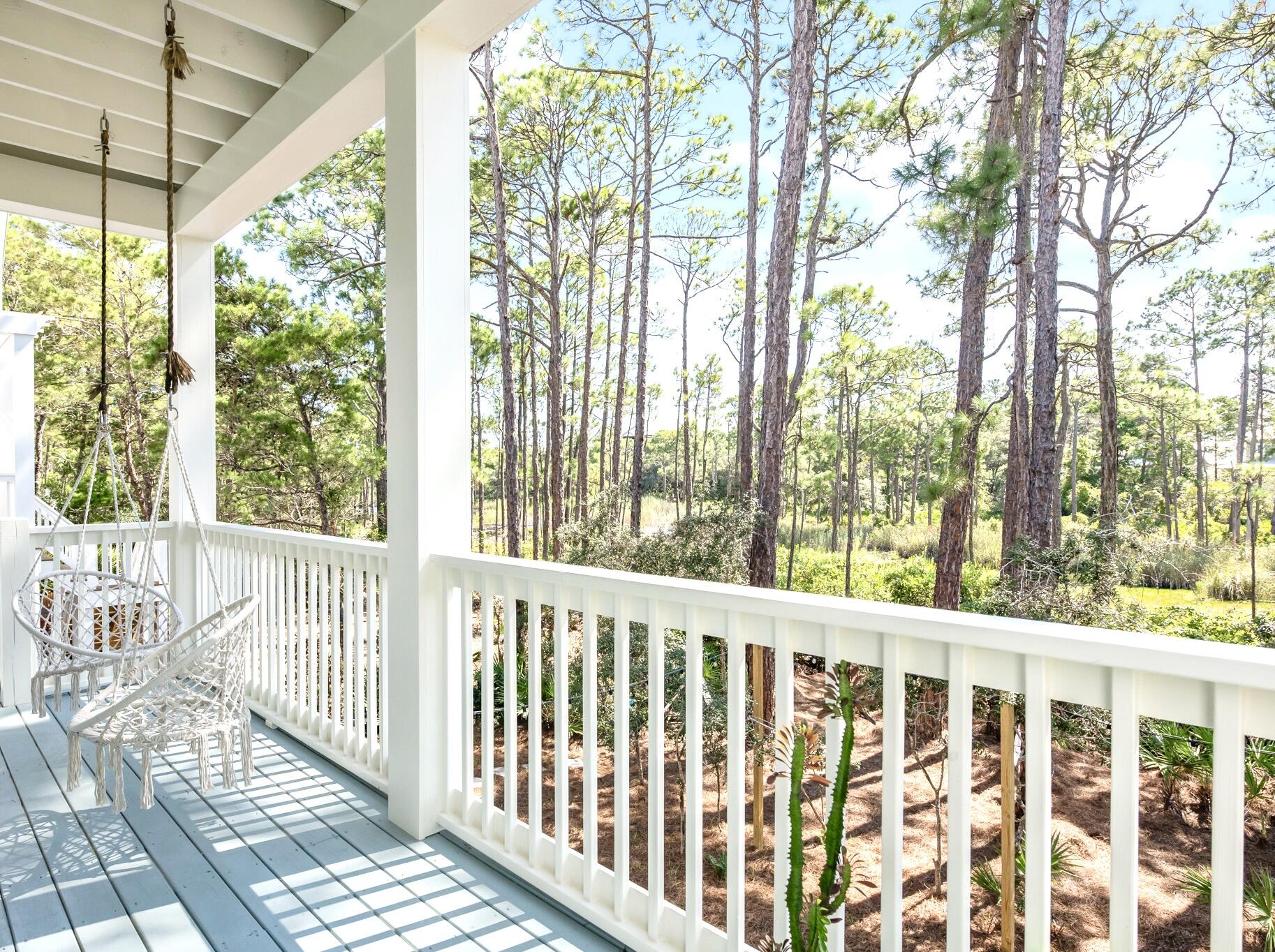 391 Matt's Way Santa Rosa Beach, FL 32459 - Photo 21 of 61 a view of a porch with wooden floor and outdoor space
