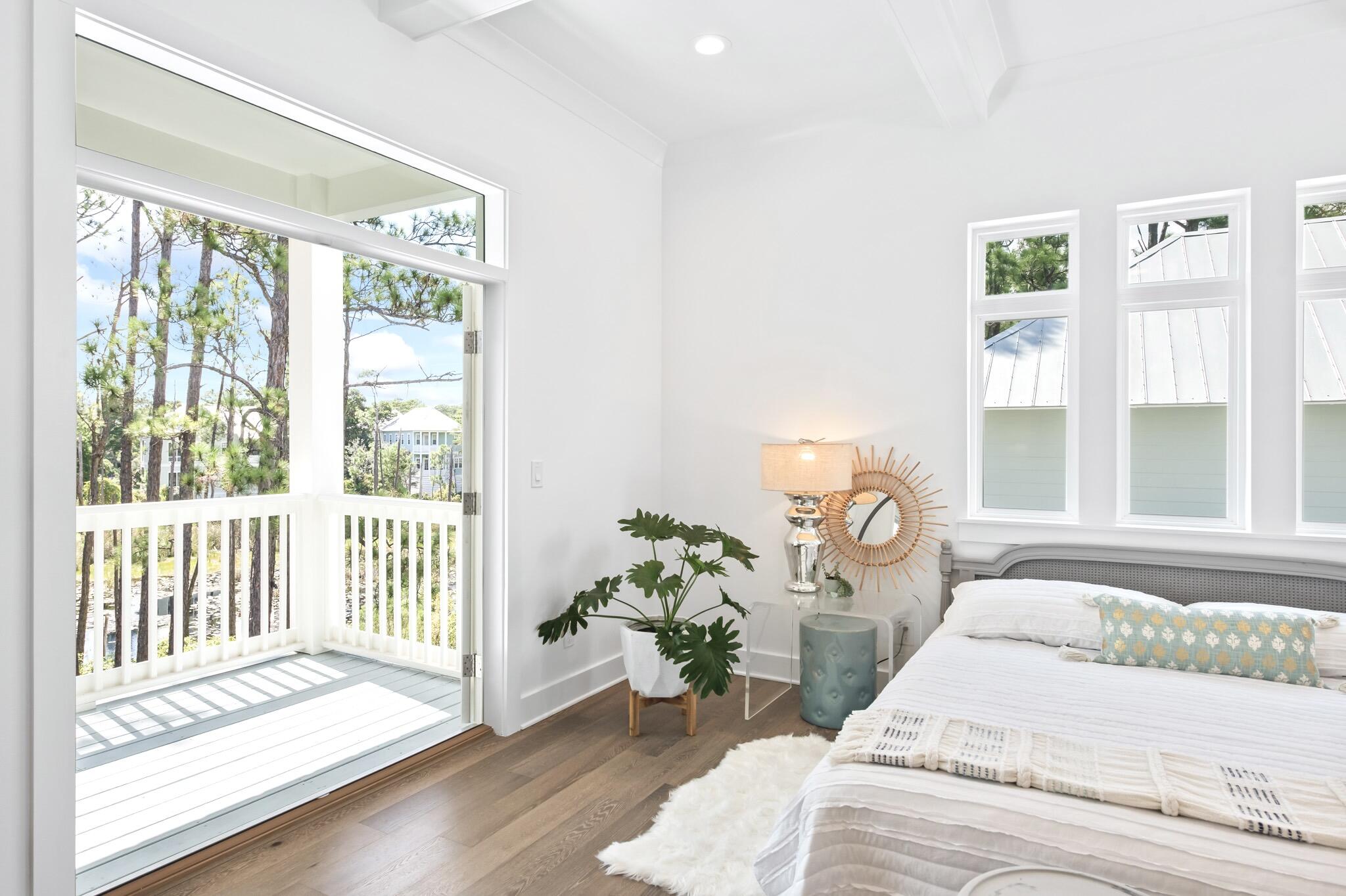 391 Matt's Way Santa Rosa Beach, FL 32459 - Photo 26 of 61 a bedroom with a bed and a large window