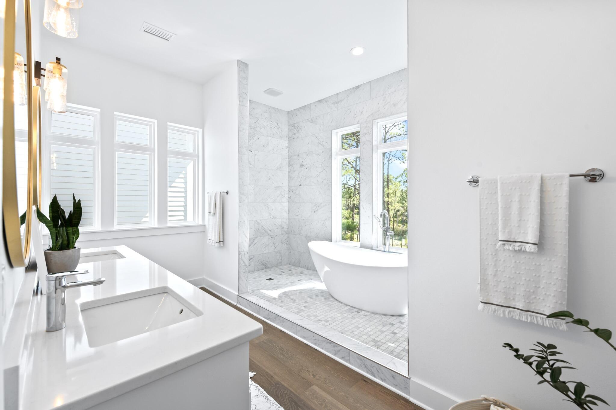 391 Matt's Way Santa Rosa Beach, FL 32459 - Photo 29 of 61 a bathroom with a granite countertop sink and a large mirror