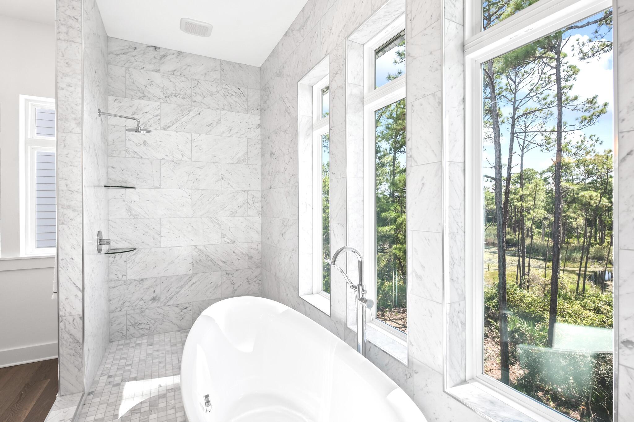 391 Matt's Way Santa Rosa Beach, FL 32459 - Photo 31 of 61 a bathroom with a bathtub and shower
