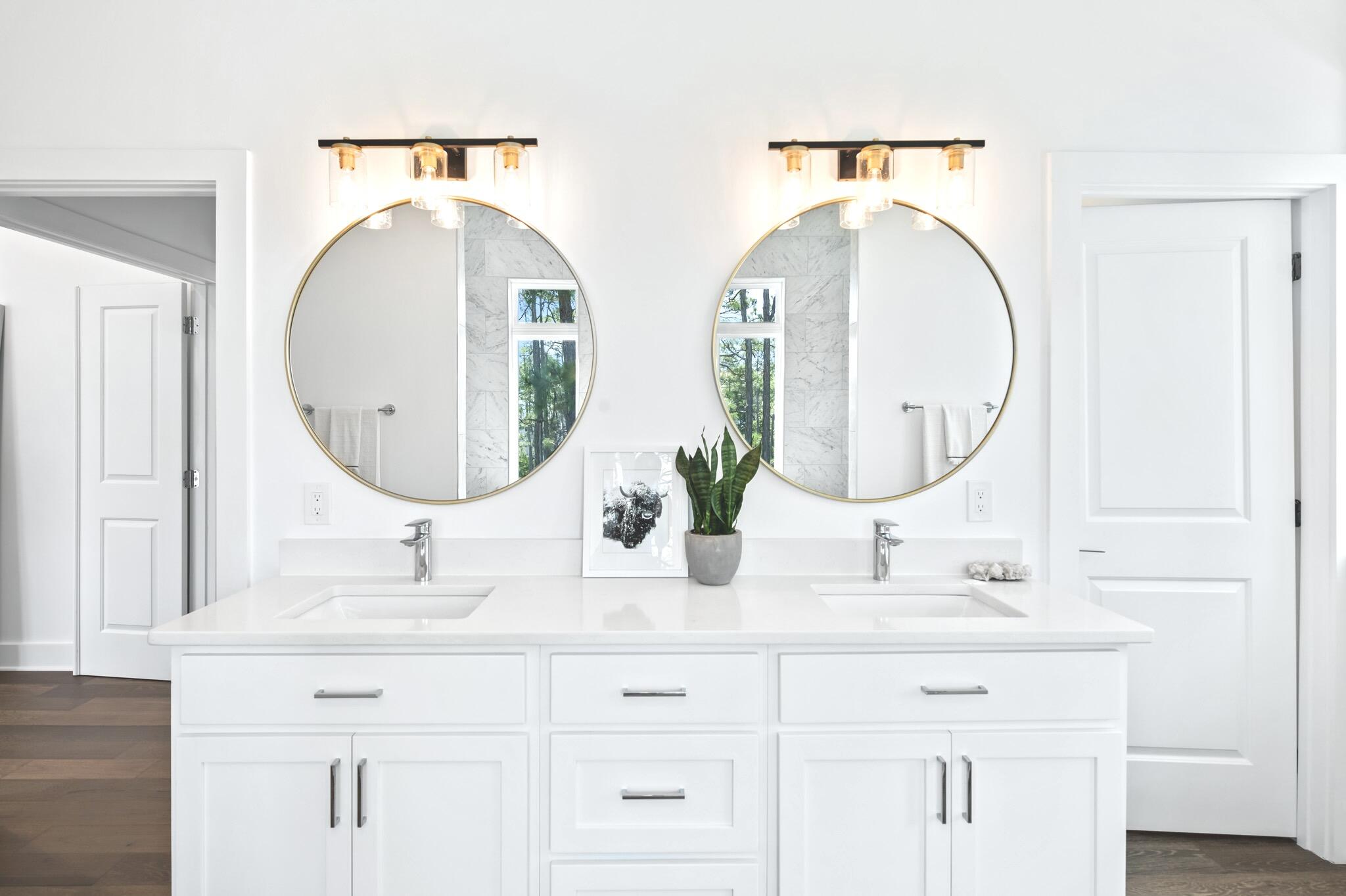 391 Matt's Way Santa Rosa Beach, FL 32459 - Photo 35 of 61 a bathroom with double vanity sinks and a mirror