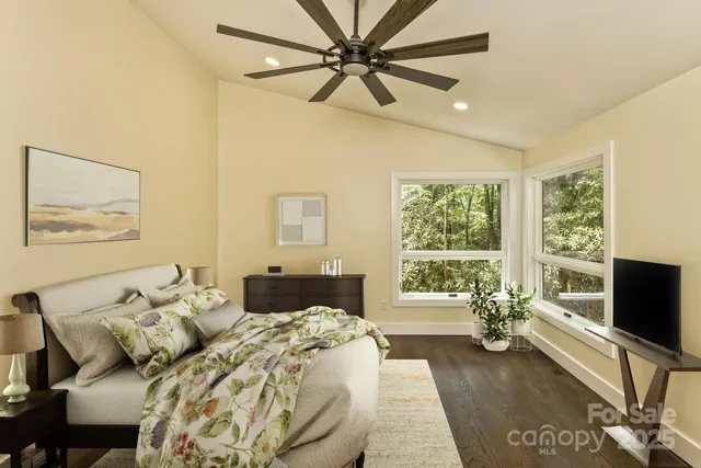 a bedroom with a bed and a couch