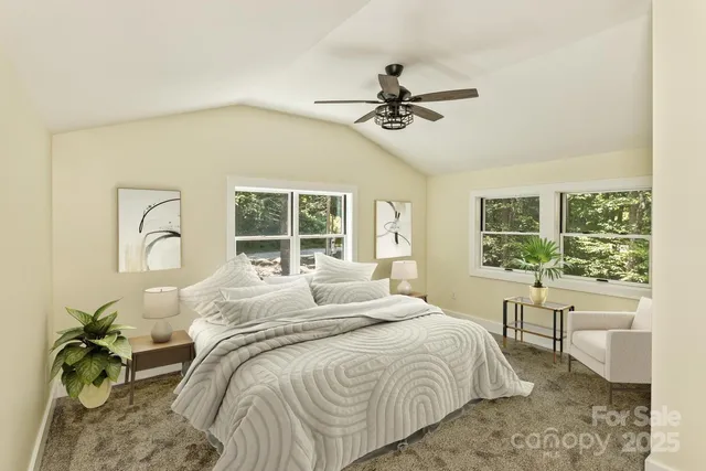 a bedroom with a large bed and a window