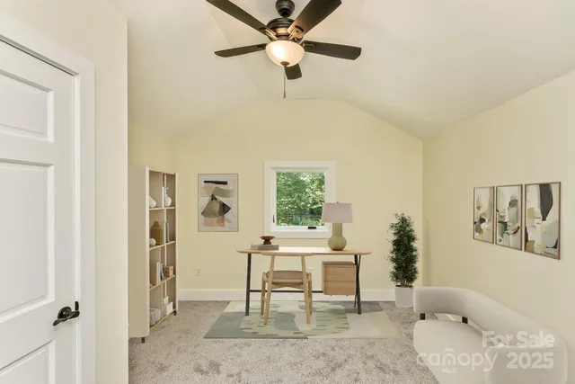 a work room with furniture and a window