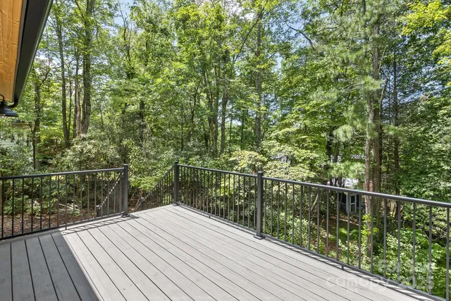 a view of a balcony with wooden floor