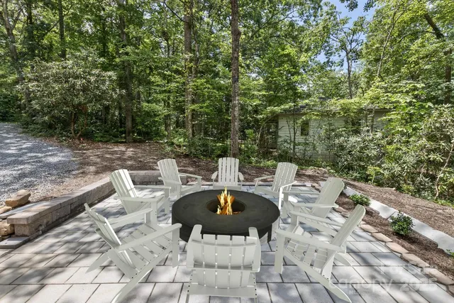 a view of a patio with couple of chairs