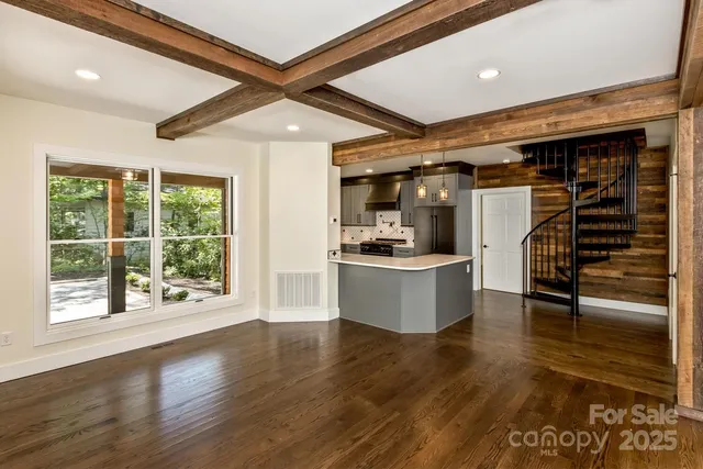 a view of kitchen with furniture and wooden floor