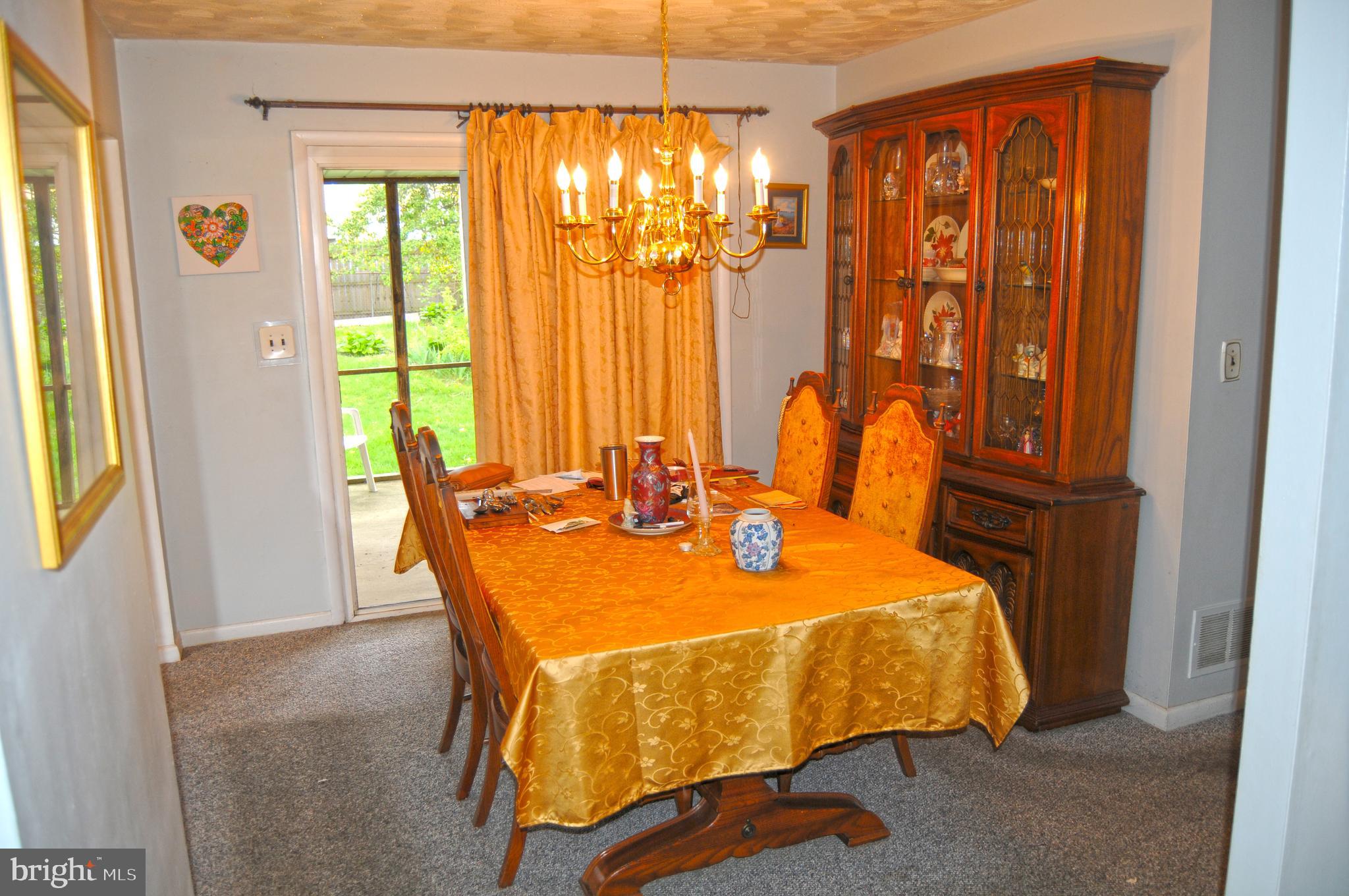 523 Crisfield Road Baltimore, MD 21220 - Photo 9 of 15 Dining rook with slider to back porch