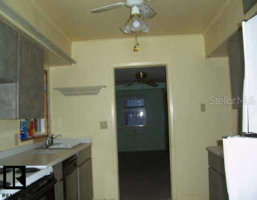 5651 River Gulf Road Port Richey, FL 34668 - Photo 1 of 1 a bathroom with a sink a mirror and a shower