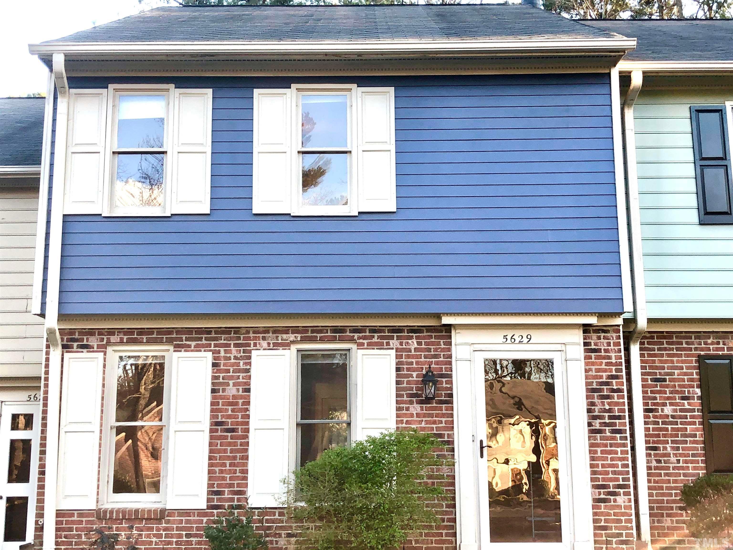5629 Hamstead Crossing Raleigh, NC 27612 - Photo 1 of 28 a view of brick building with large windows