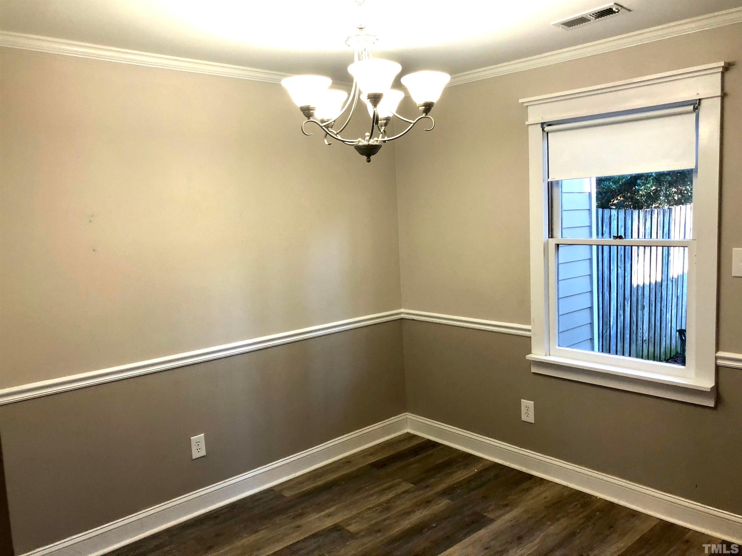 5629 Hamstead Crossing Raleigh, NC 27612 - Photo 11 of 28 a view of a small space with wooden floor and a window