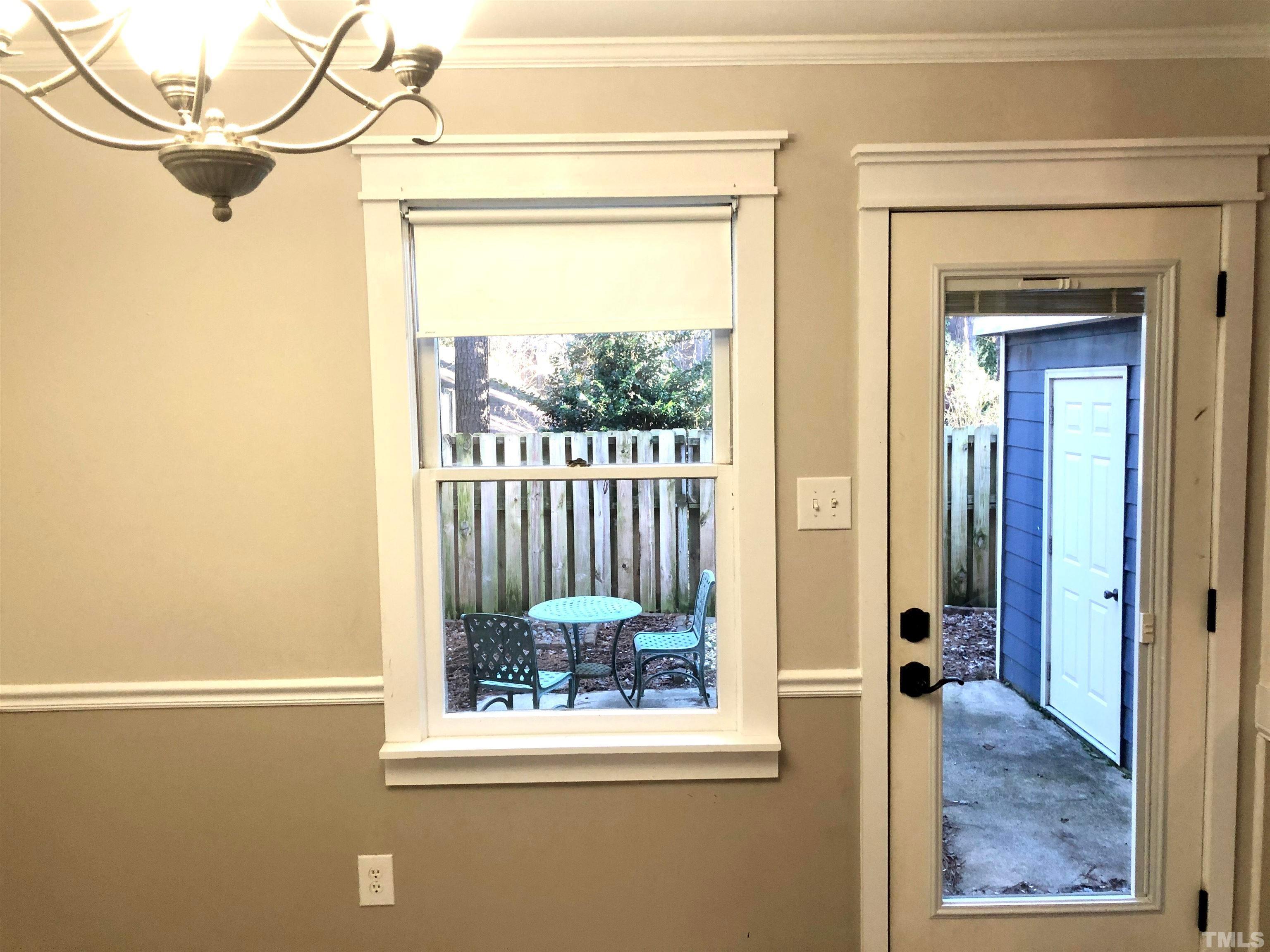 5629 Hamstead Crossing Raleigh, NC 27612 - Photo 12 of 28 a view of a room that has a window and wooden floor