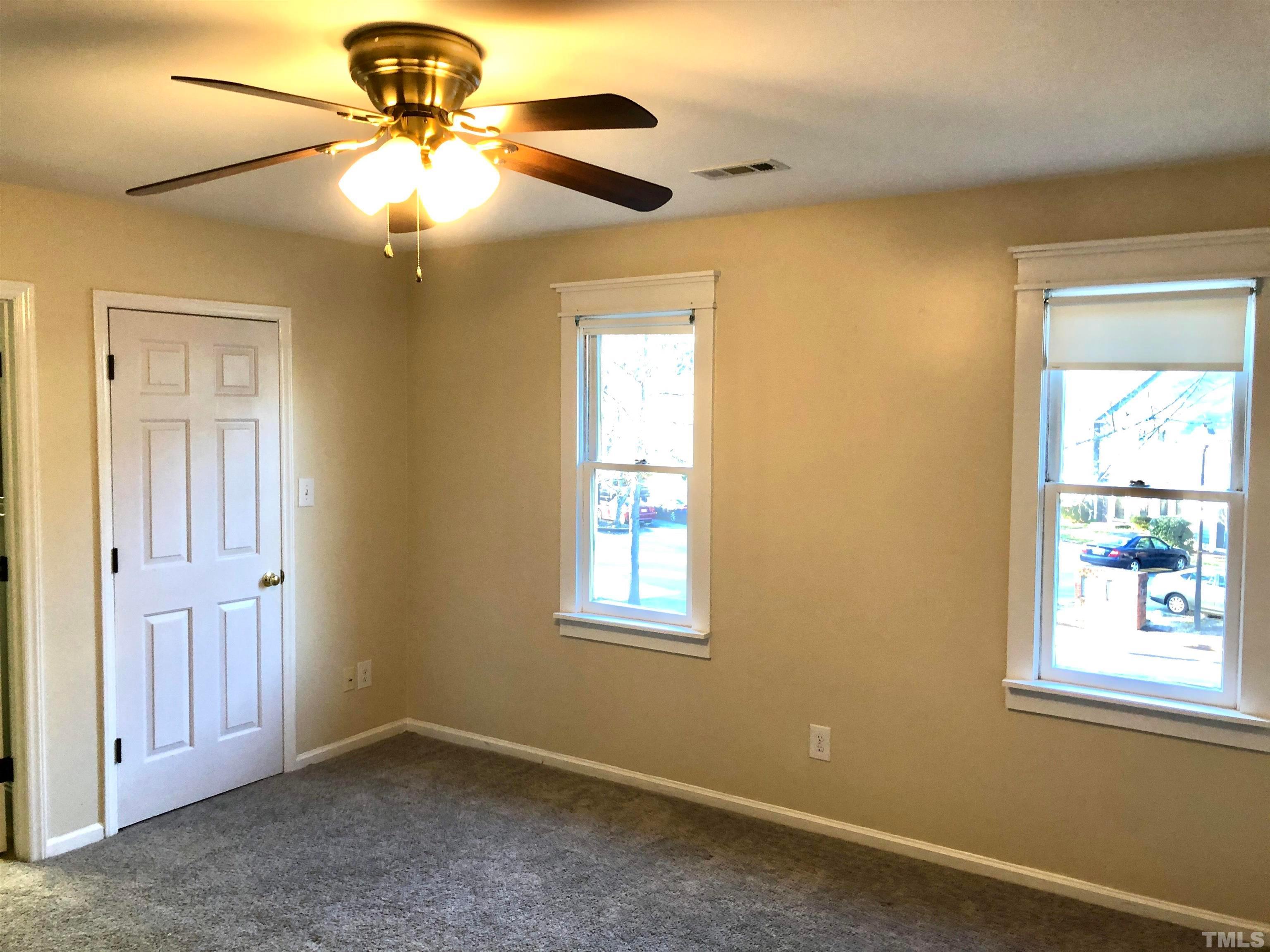 5629 Hamstead Crossing Raleigh, NC 27612 - Photo 18 of 28 an empty room with windows and fan