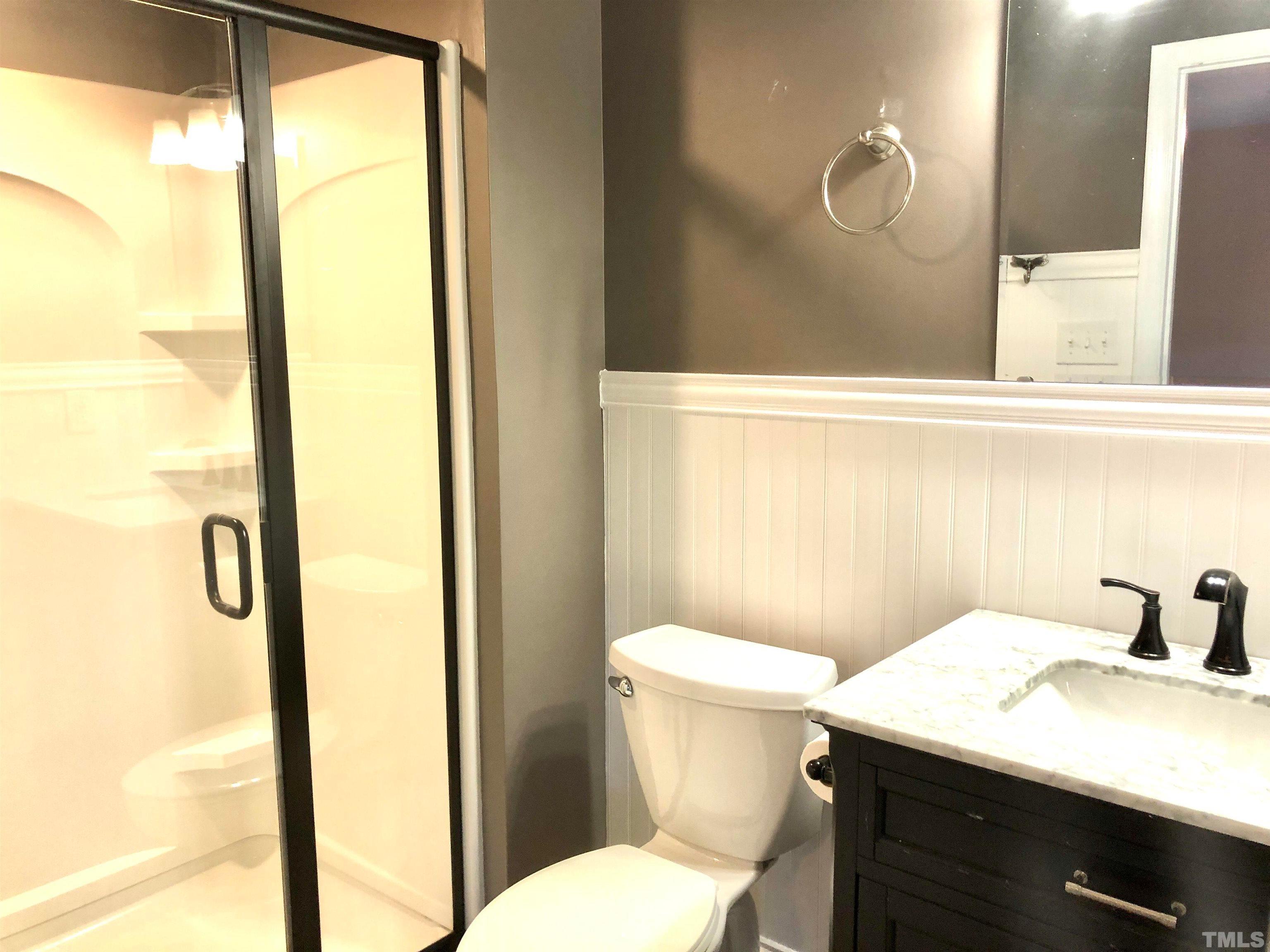 5629 Hamstead Crossing Raleigh, NC 27612 - Photo 20 of 28 a bathroom with a sink and a mirror