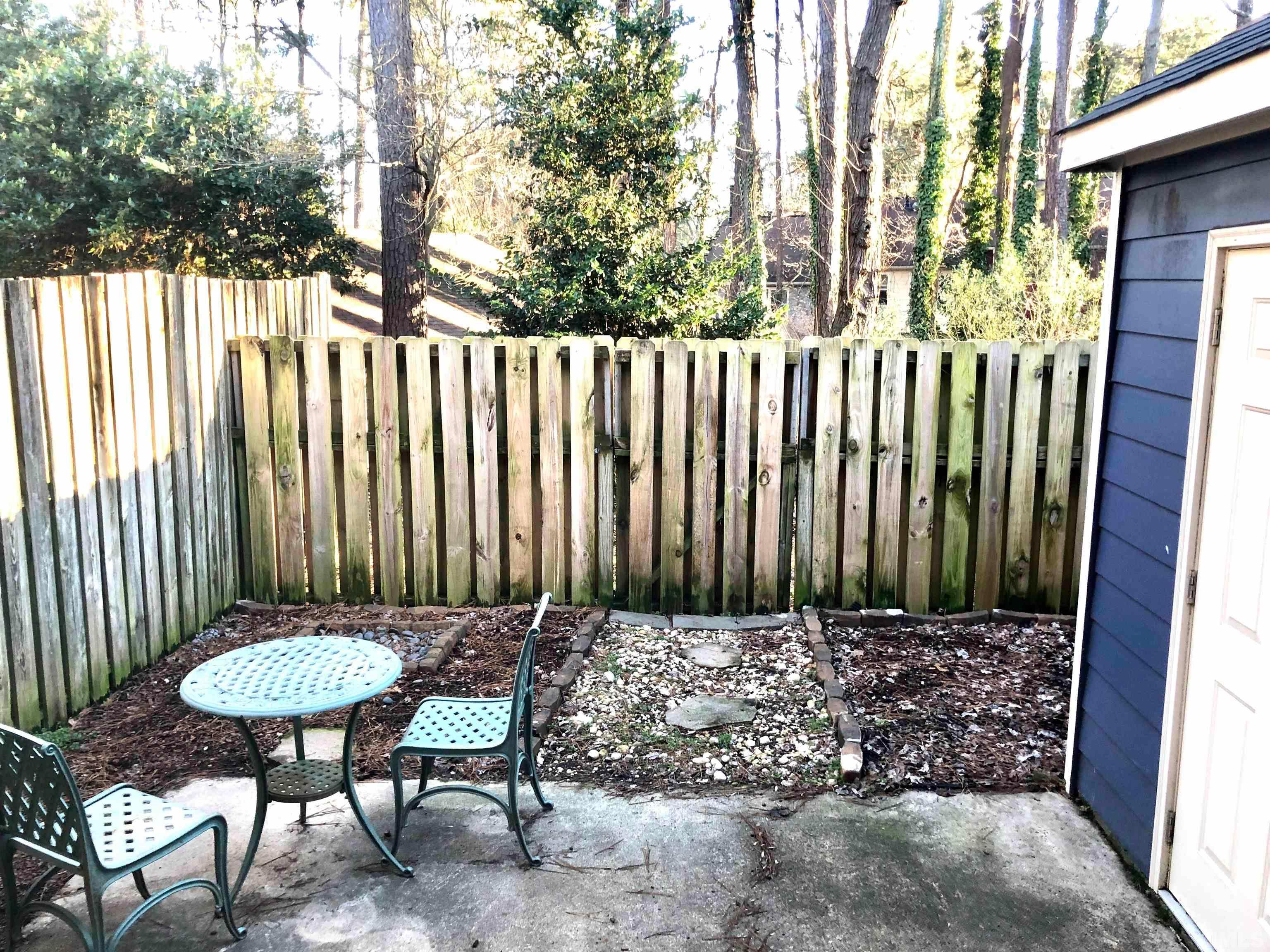 5629 Hamstead Crossing Raleigh, NC 27612 - Photo 26 of 28 a view of a chairs in backyard of the house