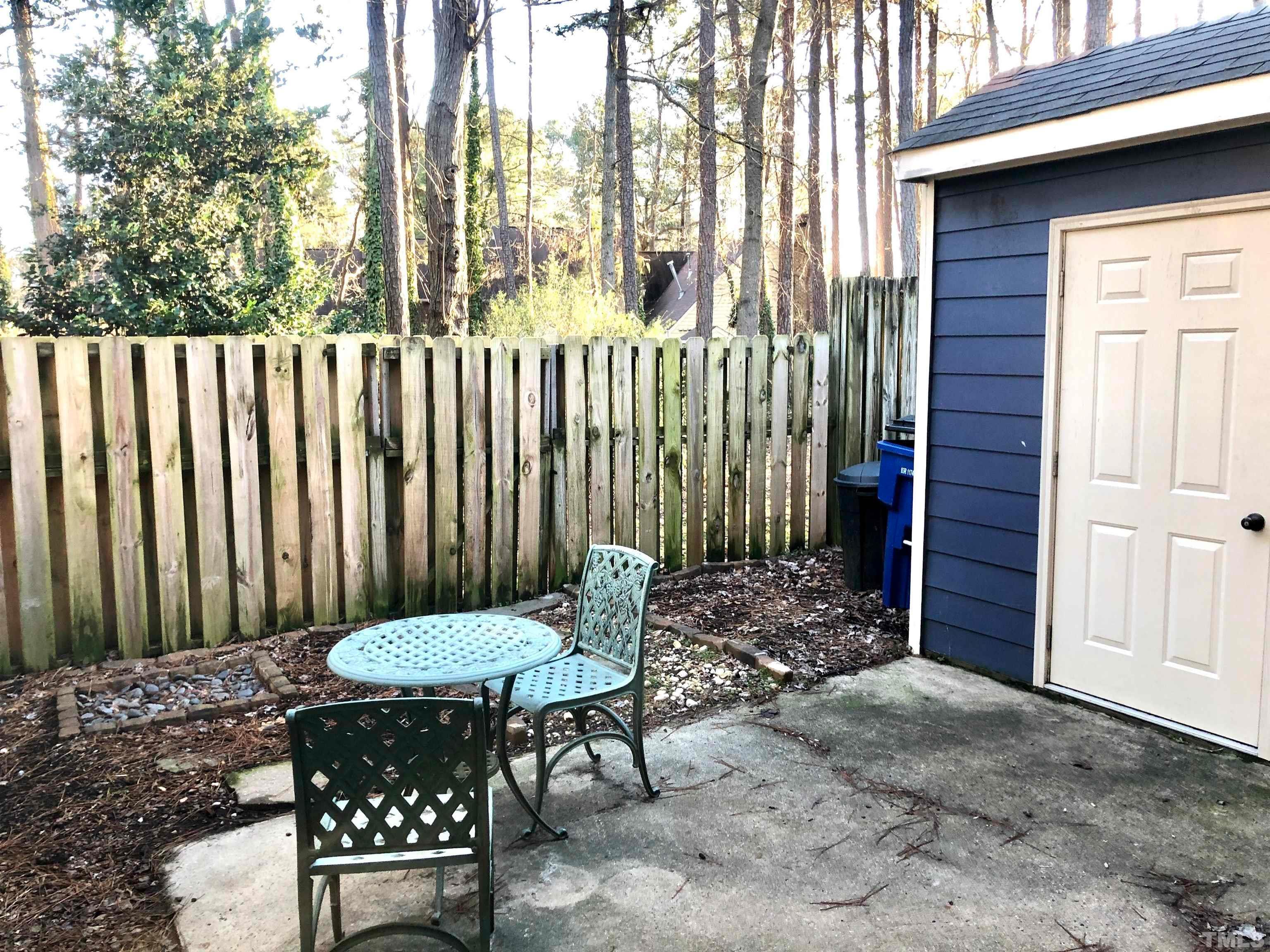 5629 Hamstead Crossing Raleigh, NC 27612 - Photo 27 of 28 a view of a chair in wooden deck