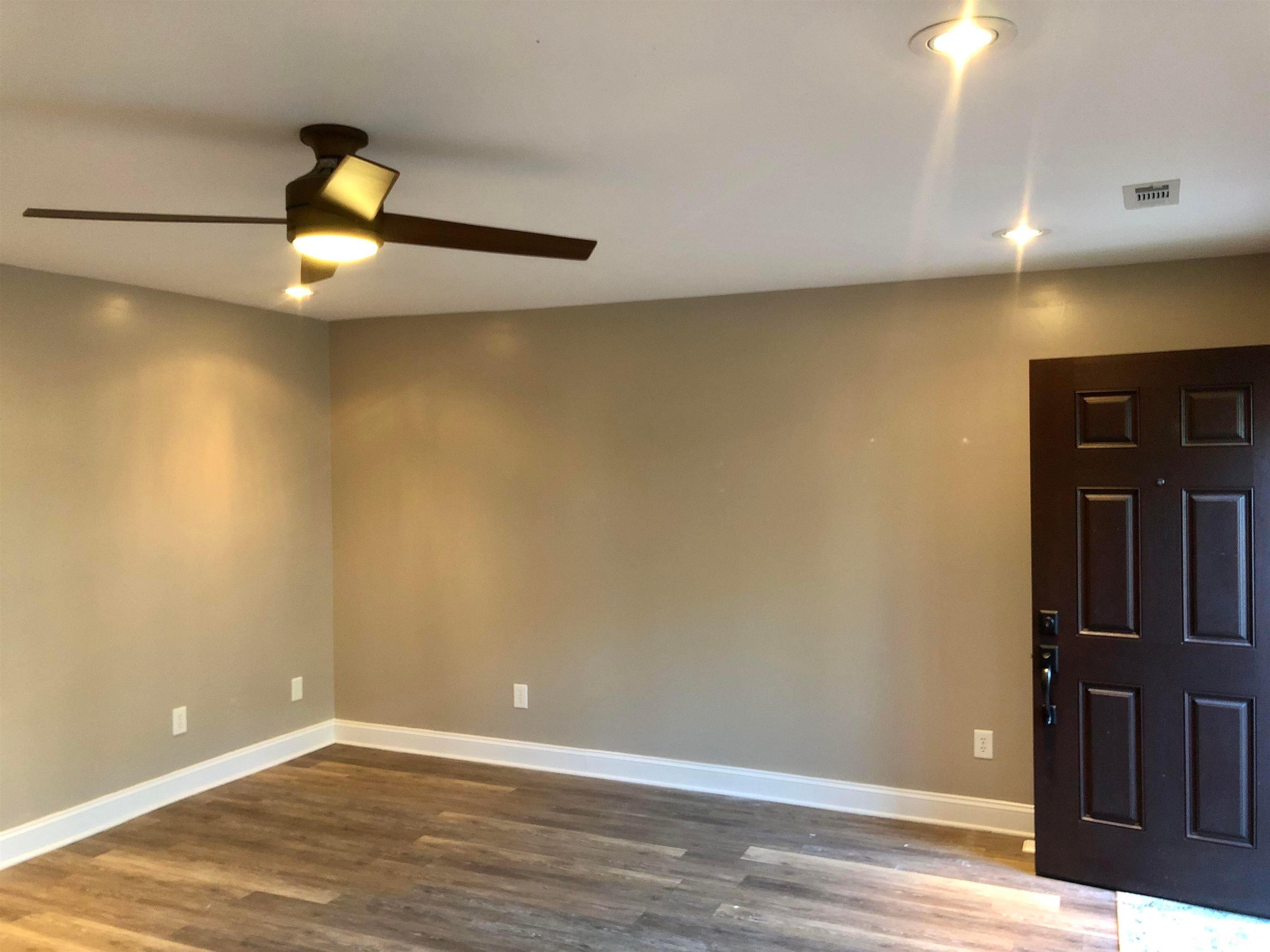 5629 Hamstead Crossing Raleigh, NC 27612 - Photo 5 of 28 a view of an empty room with wooden floor