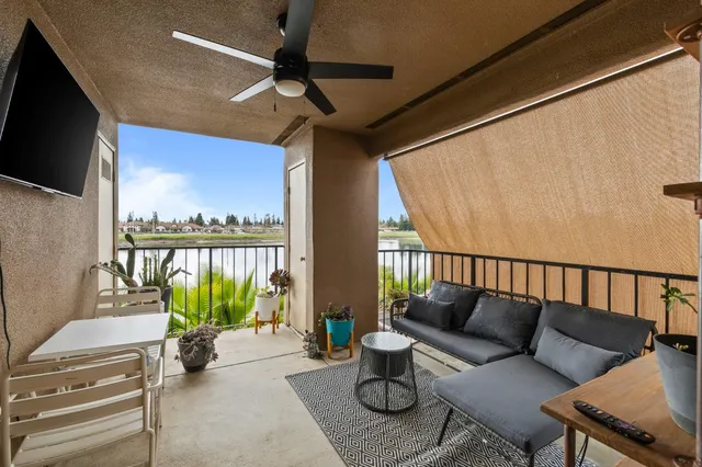 a balcony with furniture and a window