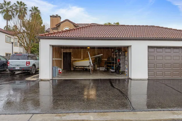 a view of a patio with table and chairs