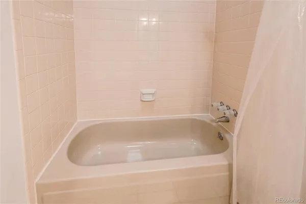 a close view of a bathtub in bathroom