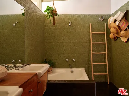 a bathroom with a sink and mirror