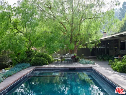 a garden view with a seating space