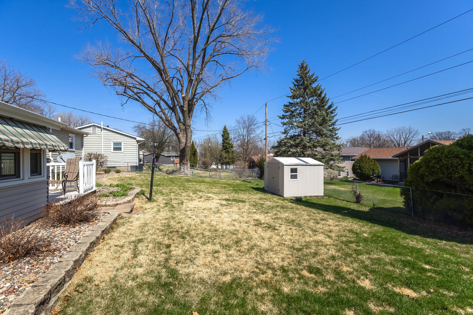 2690 9th Street East Moline, IL 61244 - Photo 17 of 19 a house with trees in front of it