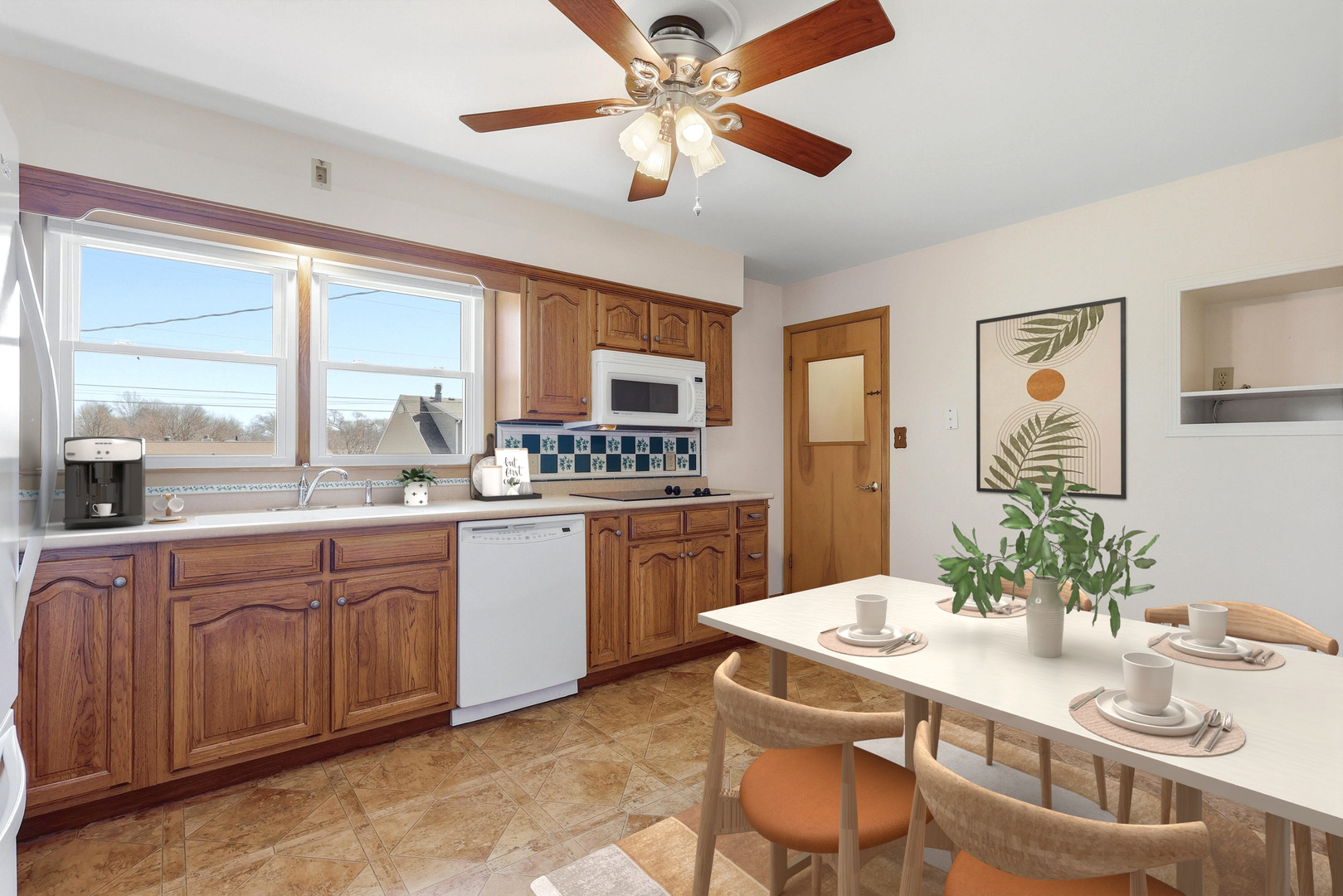 2690 9th Street East Moline, IL 61244 - Photo 3 of 19 a kitchen with a table chairs stove and cabinets