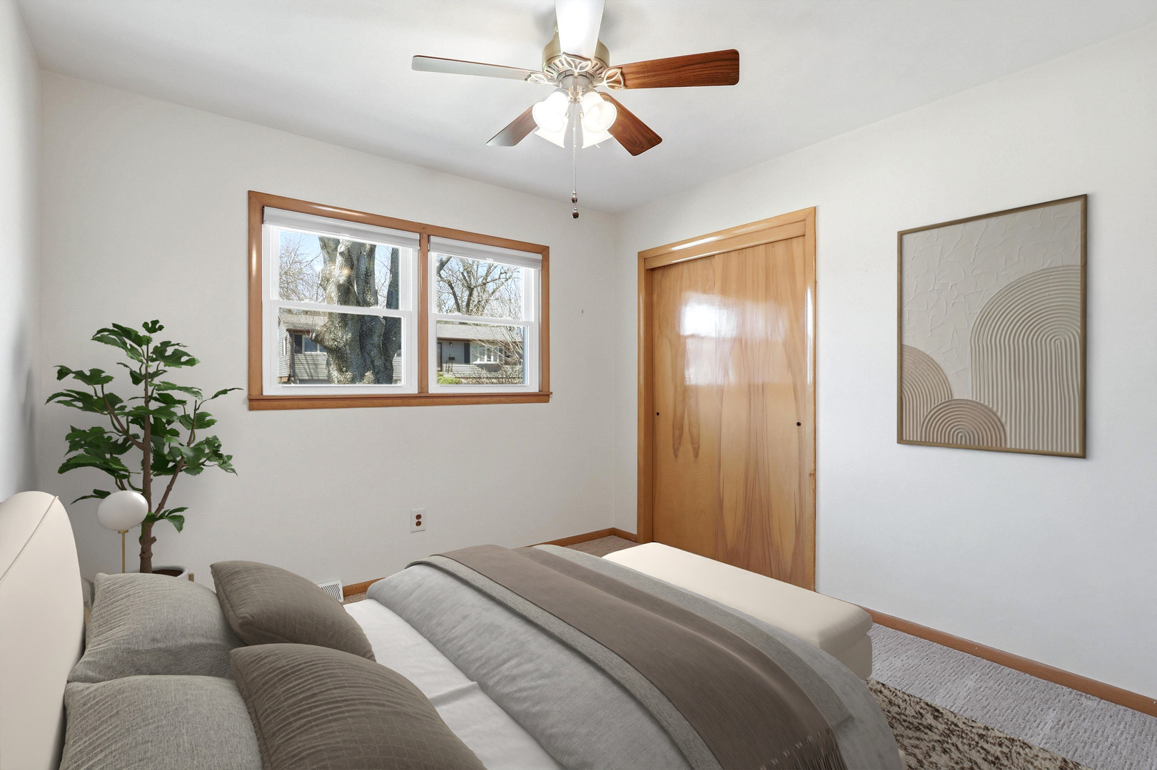 2690 9th Street East Moline, IL 61244 - Photo 7 of 19 a bedroom with a large bed couch and window