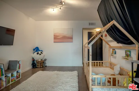 a view of living room with furniture and flat screen tv