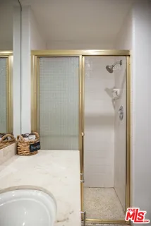 a bathroom with a bathtub and shower