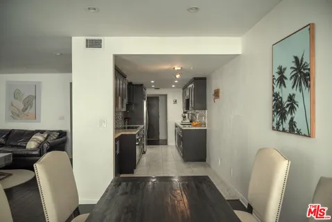 a view of kitchen with furniture and wooden floor