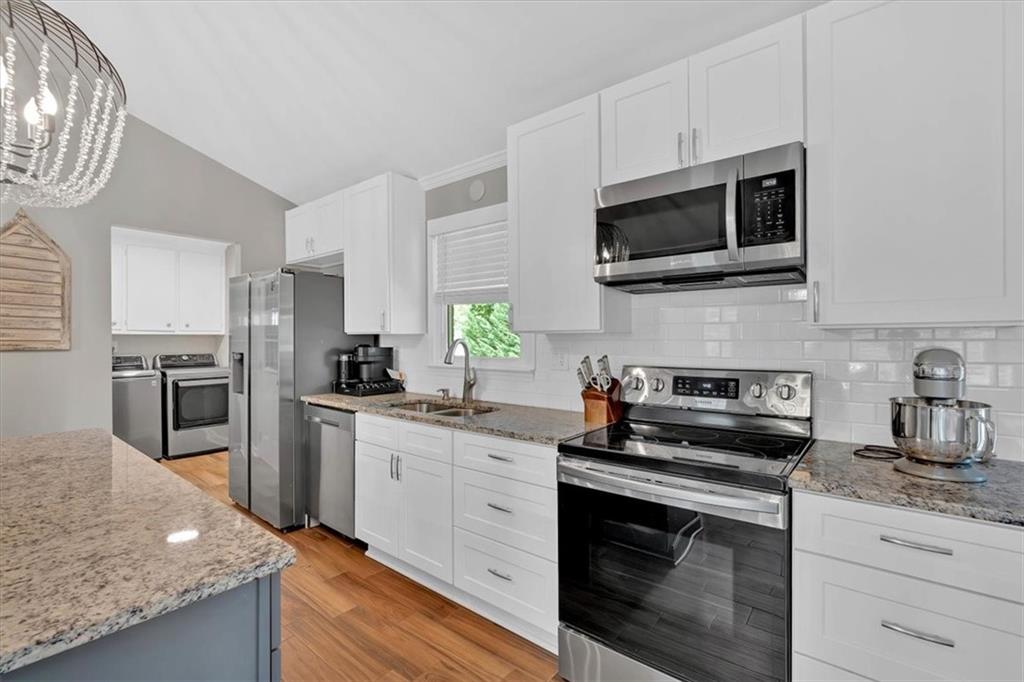 2 Milam Street Cartersville, GA 30120 - Photo 19 of 57 a kitchen with a sink stove and microwave