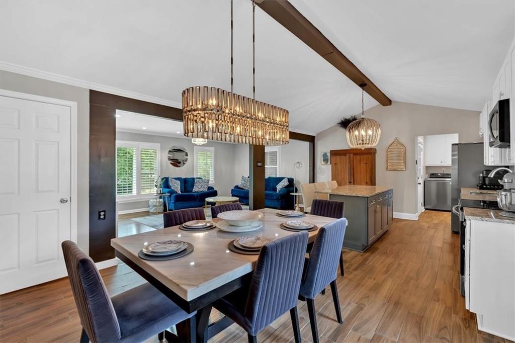 2 Milam Street Cartersville, GA 30120 - Photo 22 of 57 a view of a dining room with furniture a chandelier and wooden floor