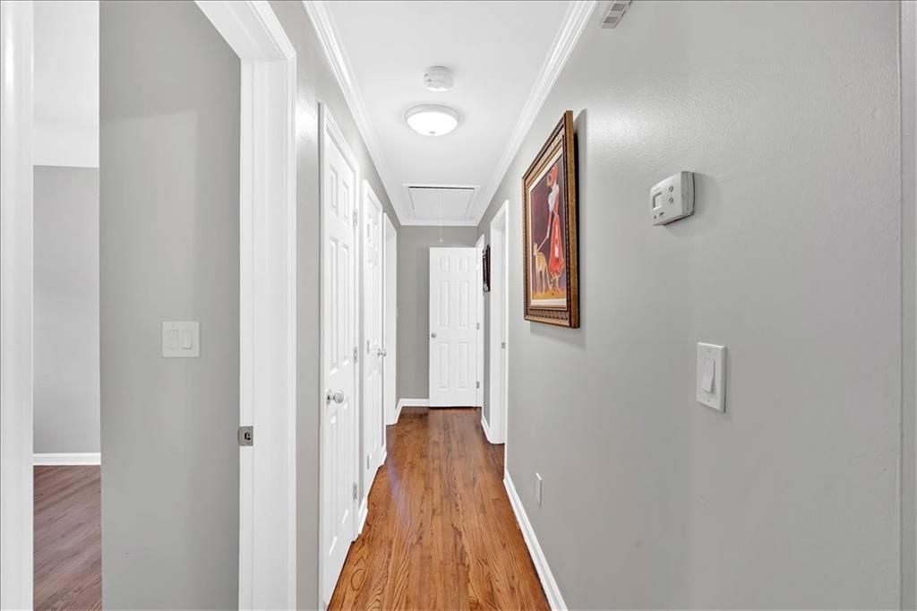 2 Milam Street Cartersville, GA 30120 - Photo 33 of 57 a view of a hallway with wooden floor and staircase