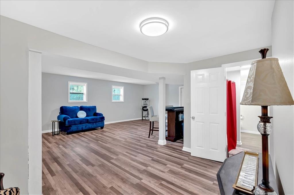 2 Milam Street Cartersville, GA 30120 - Photo 34 of 57 a bedroom with a bed and a lamp on dresser