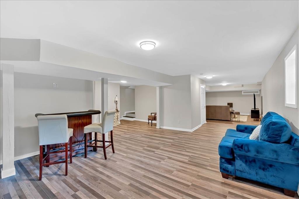 2 Milam Street Cartersville, GA 30120 - Photo 35 of 57 a living room with furniture and a wooden floor
