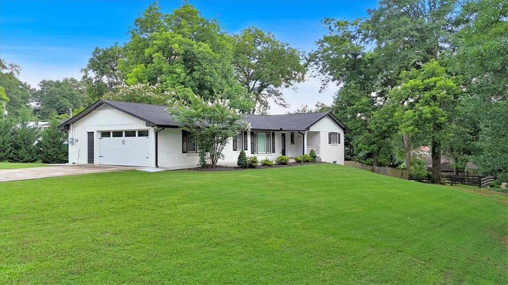 2 Milam Street Cartersville, GA 30120 - Photo 4 of 57 a front of a house with a garden