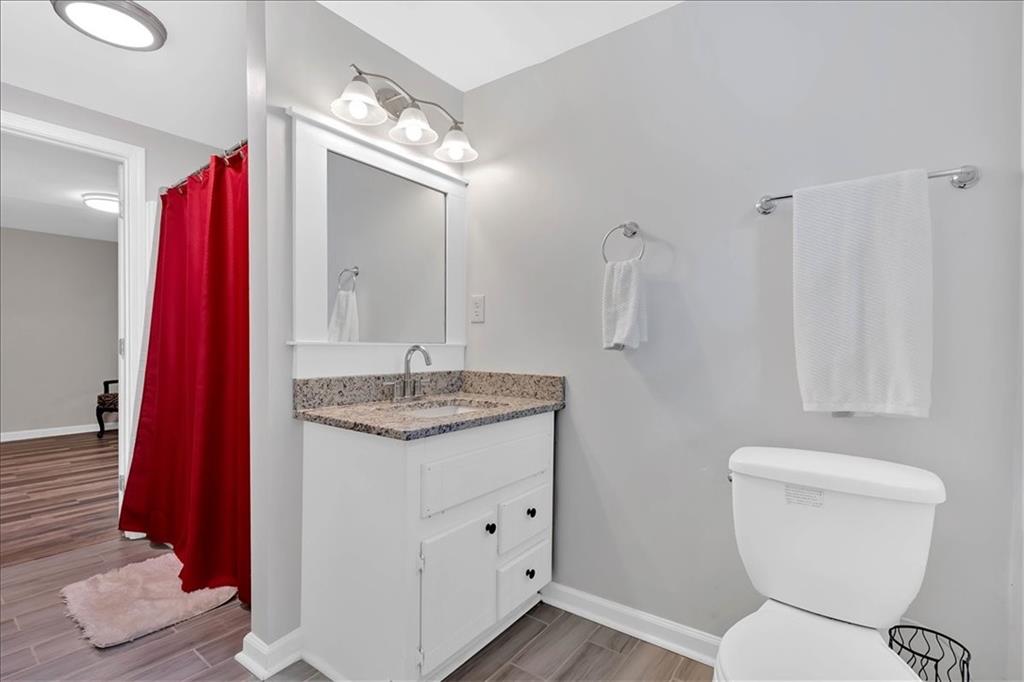2 Milam Street Cartersville, GA 30120 - Photo 43 of 57 a bathroom with a granite countertop sink toilet and shower