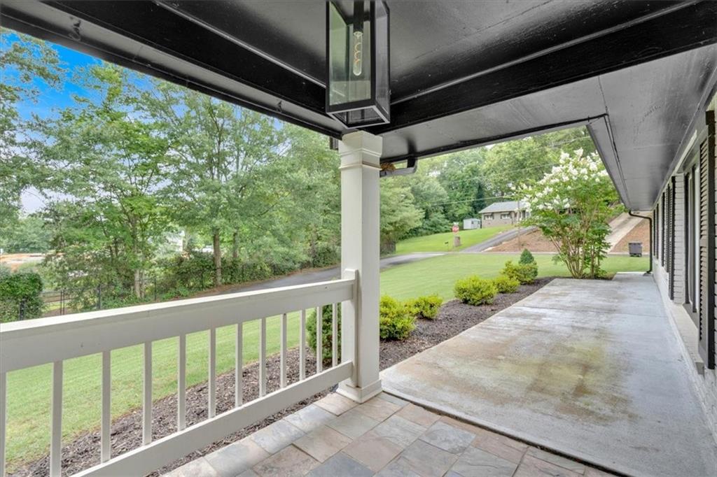 2 Milam Street Cartersville, GA 30120 - Photo 8 of 57 a view of a porch with wooden floor and outdoor space