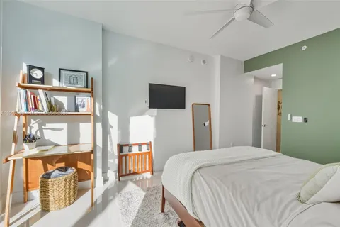 a bedroom with a bed and a cabinets