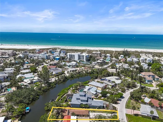 an aerial view of residential building and ocean