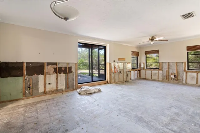 a view of a livingroom with furniture and staircase