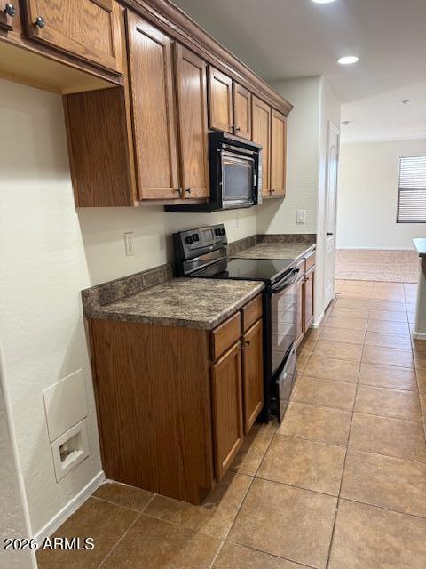1882 South Seton Avenue Gilbert, AZ 85295 - Photo 20 of 30 a kitchen with stainless steel appliances granite countertop a stove a sink and a microwave