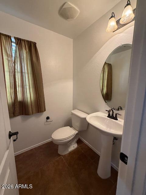 1882 South Seton Avenue Gilbert, AZ 85295 - Photo 22 of 30 a bathroom with a toilet sink and mirror