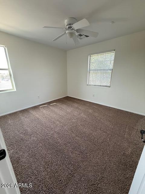 1882 South Seton Avenue Gilbert, AZ 85295 - Photo 28 of 30 an empty room with windows and fan