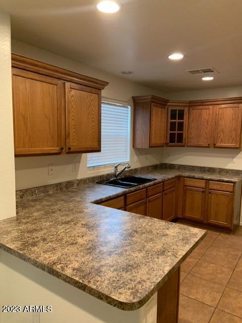 1882 South Seton Avenue Gilbert, AZ 85295 - Photo 6 of 30 a kitchen with stainless steel appliances granite countertop a sink stove and refrigerator