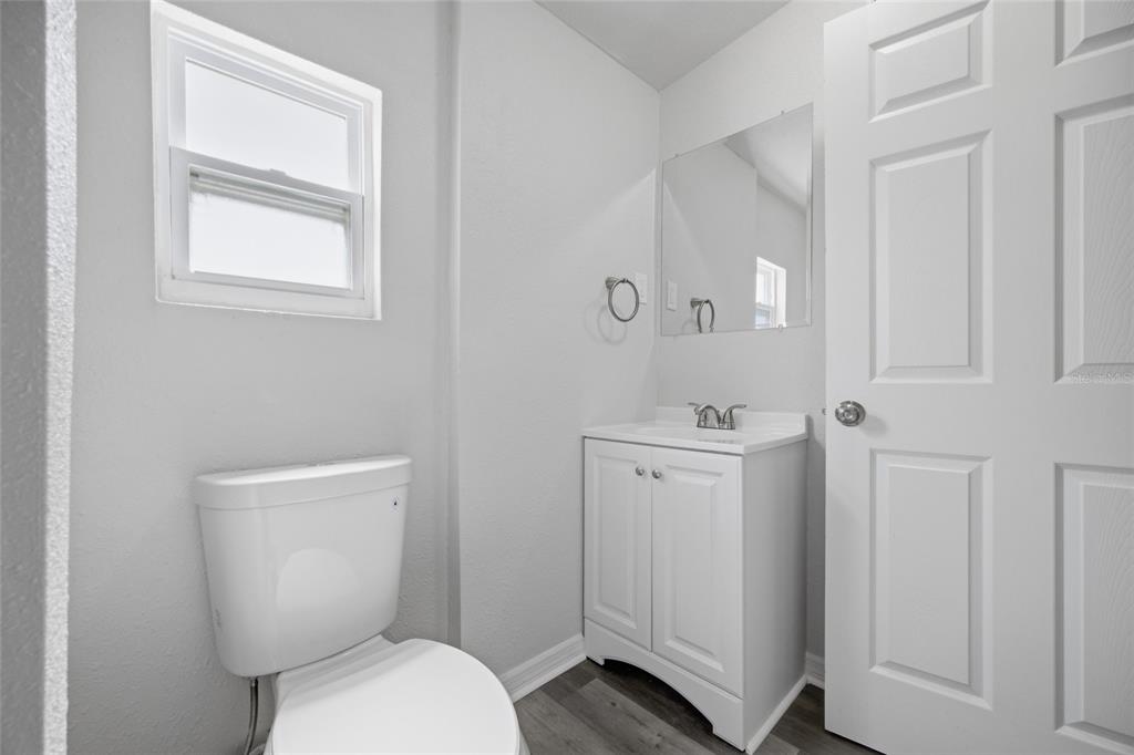6629 Sierra Terrace New Port Richey, FL 34652 - Photo 11 of 30 a white toilet sitting next to a bathroom sink